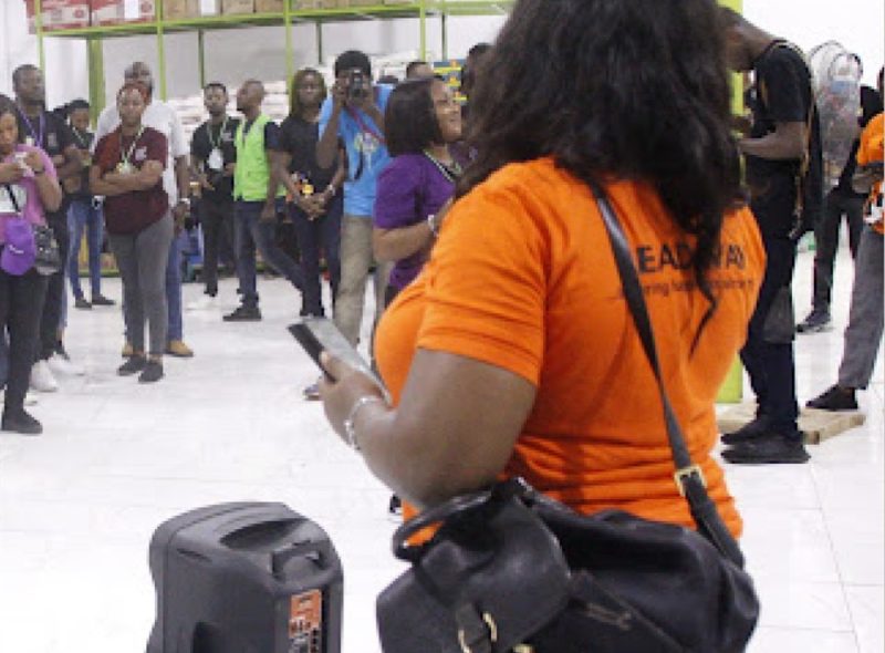 A volunteer addressing a community gathering