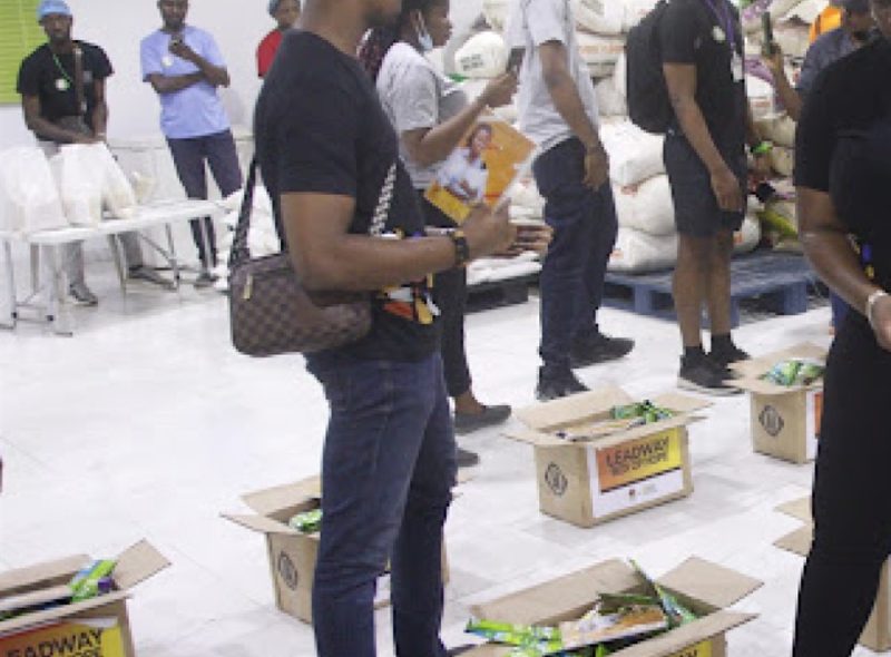 Community members receiving food and relief packages