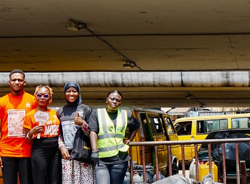 The clean-up team beside collected bags of waste
